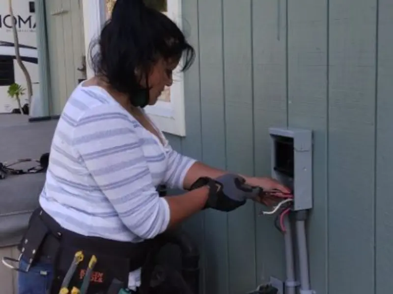 Licensed electrician wiring an exterior subpanel in Hebron